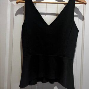 Black sleeveless peplum top